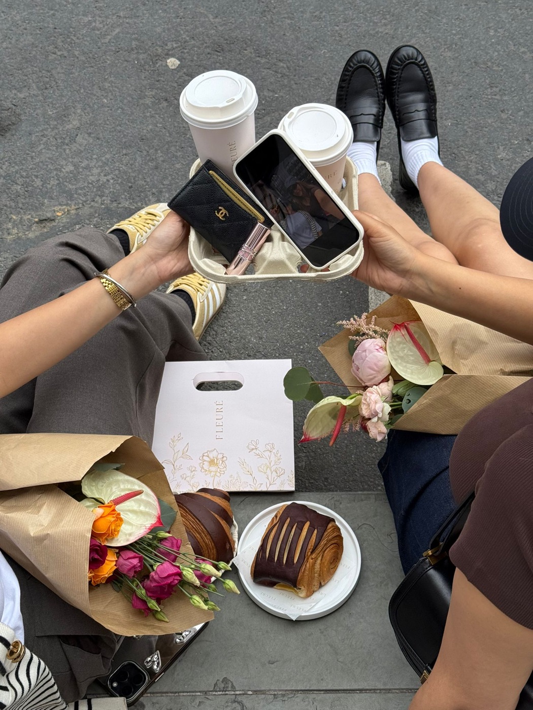 Flat-lay of Fleurè flowers, drinks and pastries